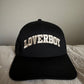 Black Letterman Loverboy Trucker Hat